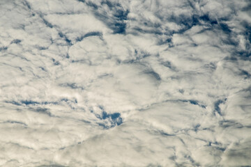 Several thick clouds covered the sky, barely visible to the sky