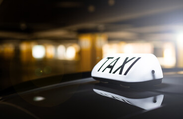 taxi in the city - order by apps - dark background
