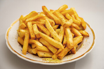Seasoned fries are on the plates.