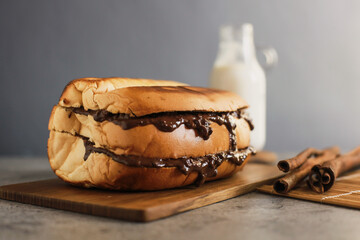 Close up delicious bread covered in crispy choco on a board, breakfast concept