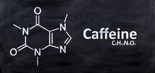 Caffeine molecule structural chemical formula, chalk drawing on a blackboard