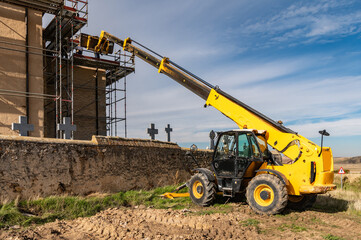 Forklift in the restoration work of a church in Spain