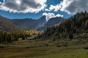 Beautiful alpine countryside. Scenic image of famous Sassolungo peak with overcast perfect blue sky. Wonderful Vall Gardena under sunlight. Majestic Dolomites Mountains. Amazing nature Landscape