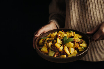 Fried potatoes with chanterelle mushrooms.