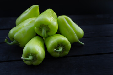 Sweet peppers on wooden background