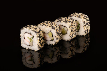 Fresh sushi rolls california ebi on a black background with reflection. Sushi menu, japanese kitchen.
