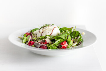 Salad with Italian burrata cheese, arugula, cherry tomatoes, parmesan and raspberry with balsamic glaze