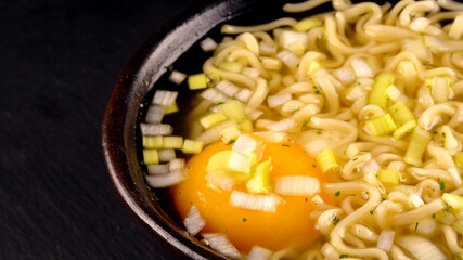 Noodle soup with egg and leek.