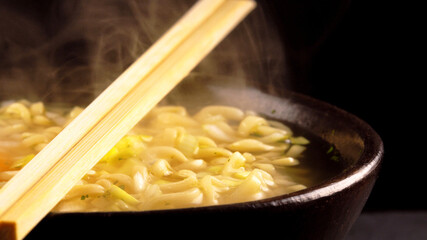 Bowl with classical chinese hot noodle soup.