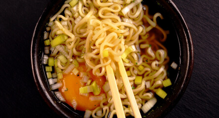 Noodle soup with egg and leek.