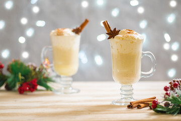 Homemade festive cinnamon eggnog for the Christmas holidays. Winter celebration table and drinks