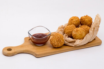 cheese balls and tomato sauce