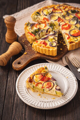Homemade quiche with vegetables and cheese, vegetarian food.
