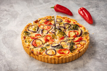 Homemade quiche with vegetables and cheese, vegetarian food.