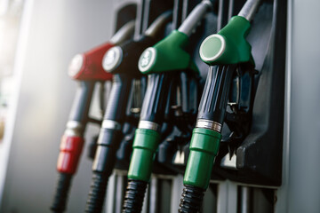 A bright photography of guns with various colours. Modern refueling station. No people.