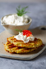Hash Browns with Sour Cream, Dill and Red Caviar. Potato pancakes