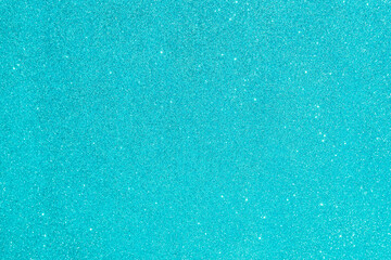 Abstract glitter blurred shiny blue aqua background. Bright sparkling bokeh wallpaper style. Festive Christmas holiday futuristic texture.