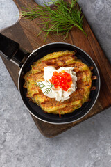 Hash Browns with Sour Cream, Dill and Red Caviar. Potato pancakes