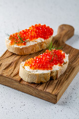 Fresh red caviar on bread. Sandwiches with red caviar.