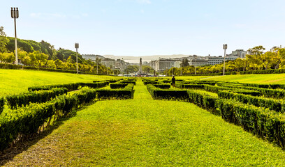 Ornamental hedges in the King Edward VII park lead you through Lisbon, Portugal to the Tagus river