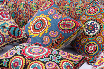 Bright multicolored uzbek pillows close up