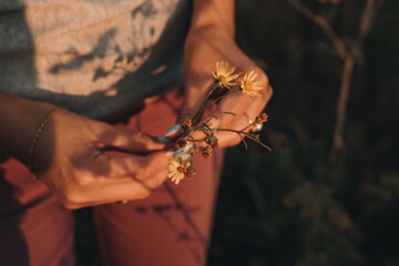 hand with a flower