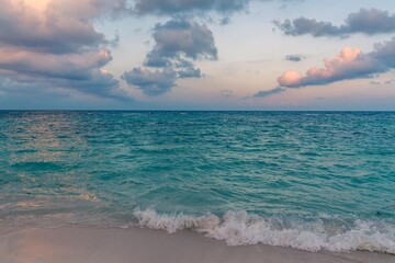 mexico beach with waves and clouds golden hour