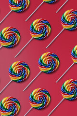 Fototapeta na wymiar Colorful lollipop pattern on pink background