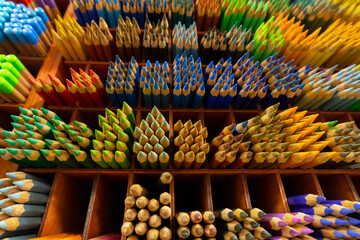 Colored pencils on the counter in an art store. Large set of selection of colored pencils.
