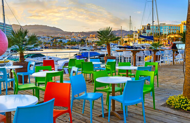 The colorful chairs of the coastal cafe, Eilat, Israel