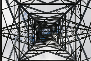 Dark metal struts clutter this abstract industrial image of a pylon