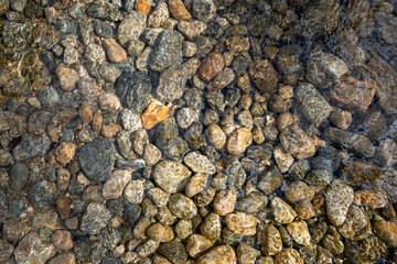river stones under water