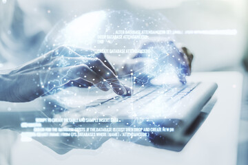 Multi exposure of abstract software development hologram with world map and hands typing on computer keyboard on background, global research and analytics concept