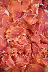 Sliced pieces of meat ham, view from above. Food products for table decoration