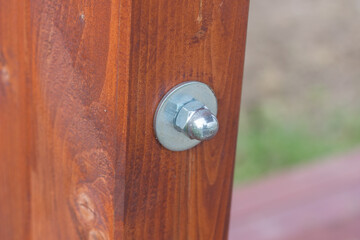 Detail of a screw in a wooden beam