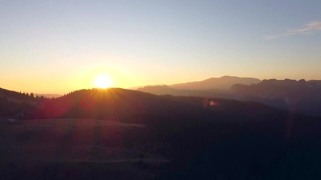 Sunset above Bucegi Mountains in Romania, Aerial View