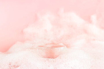 Abstract empty podium with suds on pastel pink background for presentation and exhibitions cosmetic product. Minimal concept.