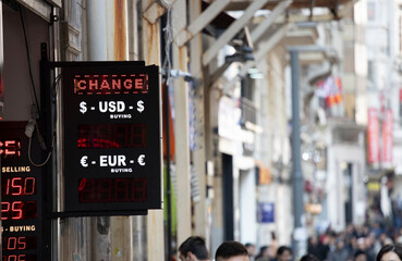 Rate of foreign currencies on the scoreboard. Close up.