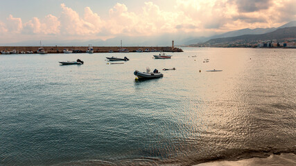 small sports motor boats in the quiet harbor of the Greek resort town of Hersonissos
