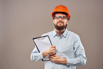 Worker man orange hard hat construction industry manual