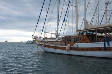 Yachts in the port and embankment of the Turkish city of Bodrum on a bright sunny day.