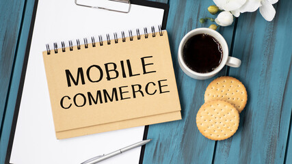 holding a card with text mobile commerce