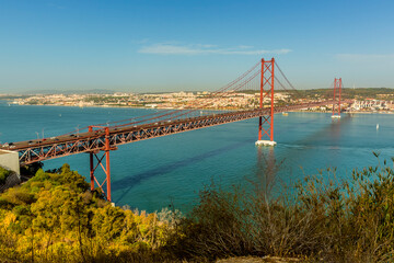 The suspension bridge over the Tagus river named after the 25th April revolution, looking towards the Belem district of Lisbon