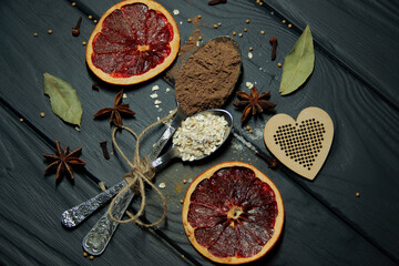 Spoons and spices. Cinnamon, salt, curry, mustard, cloves and star anise