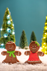 Small Kids Play in Snow At Christmas Time. Gingerbread Funny Family. Festive Greeting Card