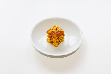 Layered shortbread pie with Apple jam on a white plate. Apple pie