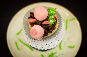 cupcake with pink frosting pig shape 2