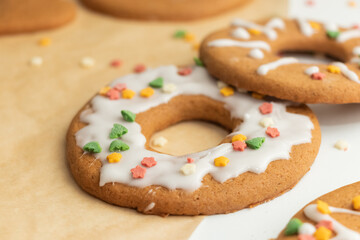 Homemade gingerbread covered with icing, delicious Christmas cookies with sprinkles