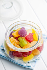 Colorful fruity jelly candies in jar.