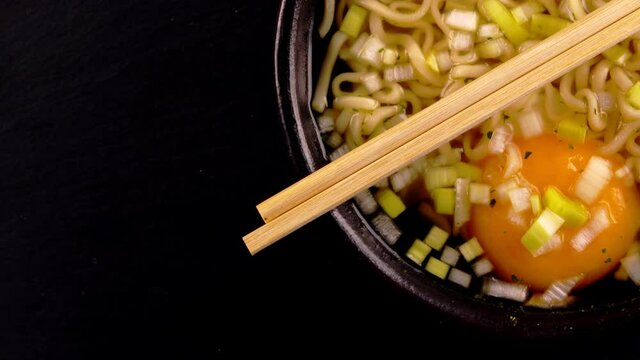Noodle soup with egg and leek.
